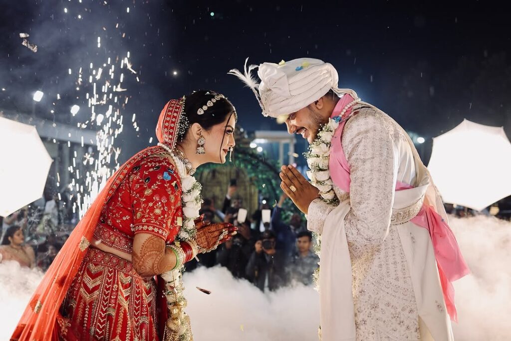 Night wedding couple candid moment with fireworks in Indian wedding photography trends 2026 captured by Vishal Photos Jaipur