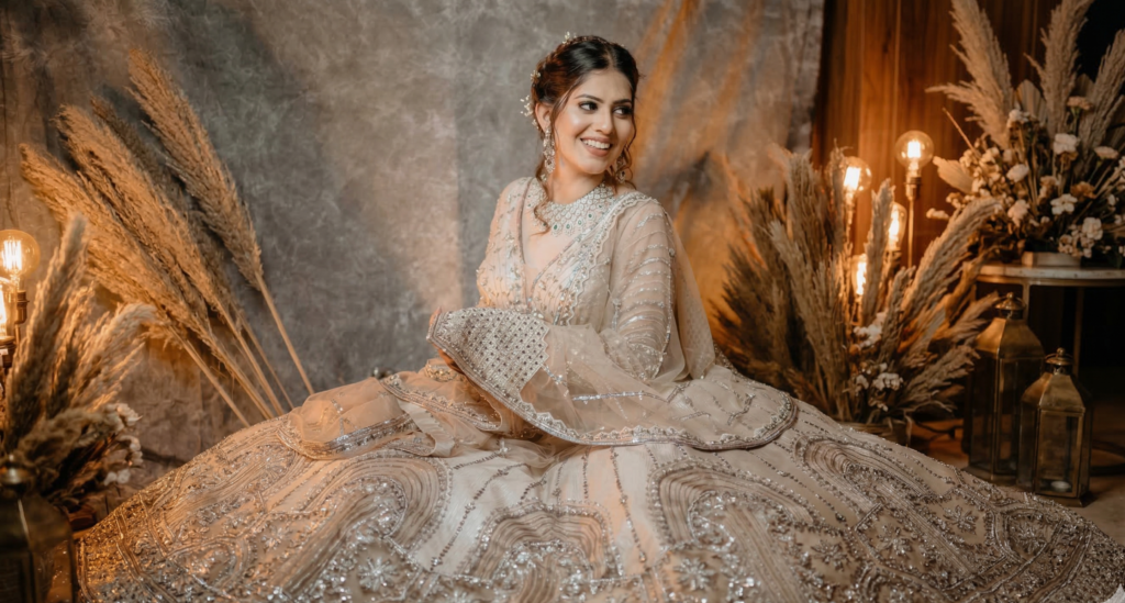 Bridal photoshoot in Udaipur at lake palace with bride in traditional lehenga posing near royal architecture