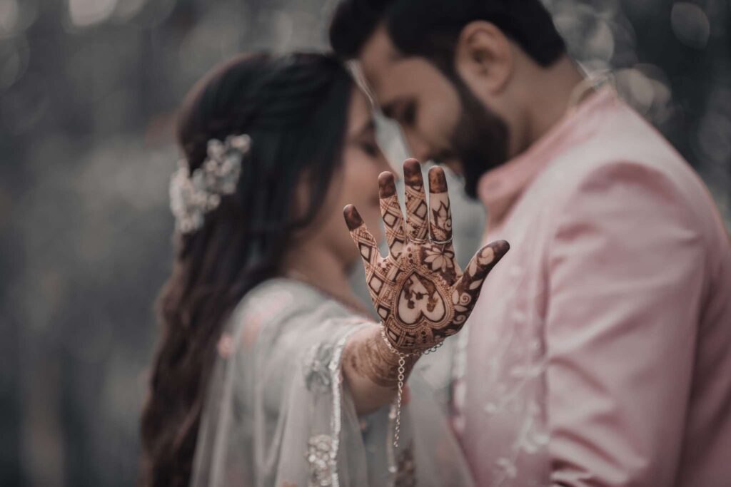 Bride showing intricate Mehndi design during a colorful Mehndi ceremony captured by Vishal Photos Jaipur in Vaishali Nagar Jaipur