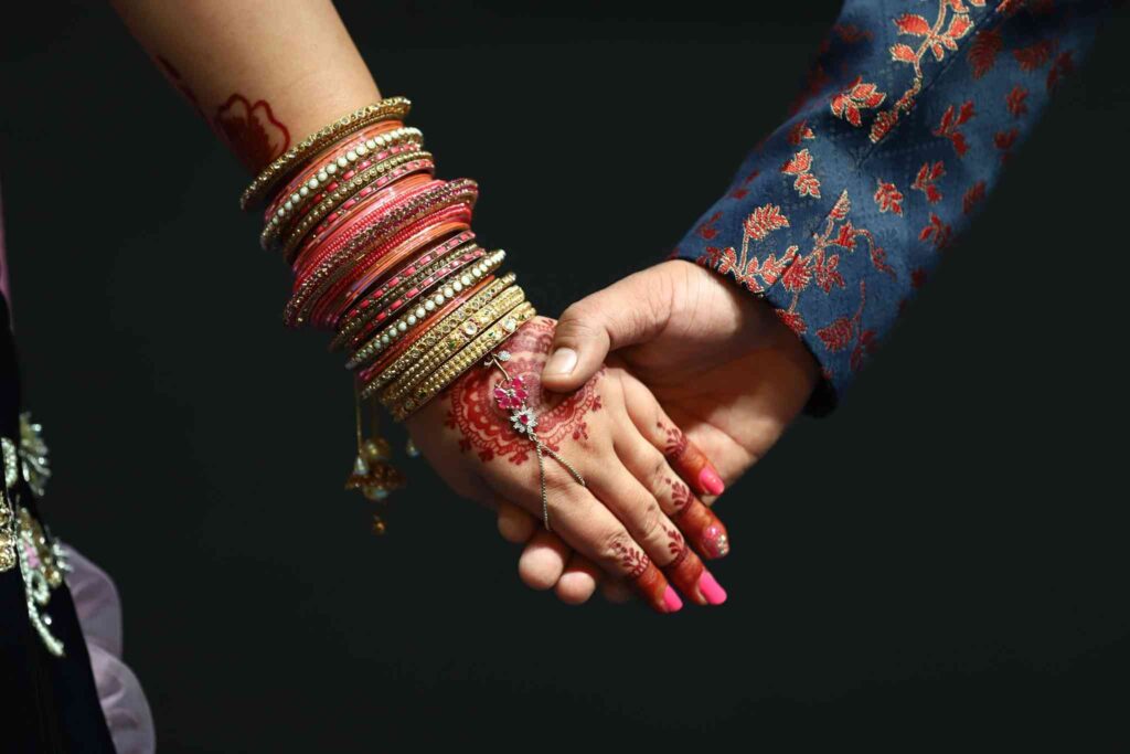 Engaged couple holding hands during ring ceremony in Vaishali Nagar Jaipur